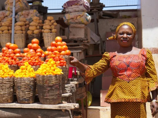 Nigerian woman selling goods in market